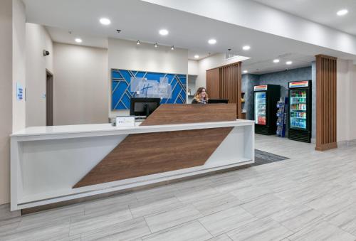 a lobby of a store with a cash register at Holiday Inn Express Hotel & Suites Shakopee by IHG in Shakopee