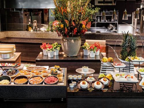 a buffet line with many different types of food at Hakone Kowakien Tenyu in Hakone