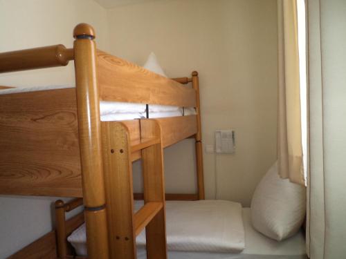 a pair of bunk beds in a room at Hotel Pinocchio in Gy