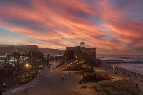 a view of a city with a cloudy sky at Mirador Canteras-Auditorio in Las Palmas de Gran Canaria