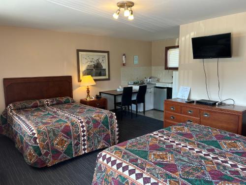 Ένα ή περισσότερα κρεβάτια σε δωμάτιο στο The Silver Birch Motel