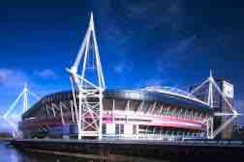 a large soccer stadium sitting on top of the water at The Little Lodge - seaside town of Penarth nr Cardiff in Penarth