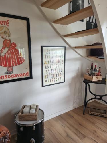 a room with a staircase and a picture on the wall at Marsvinslund bed and breakfast in Viborg