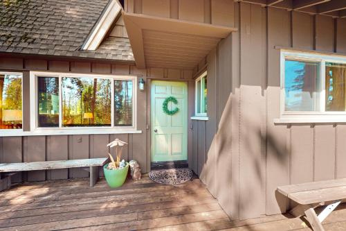 a front porch of a house with a blue door at Fernwood in Shaver Lake