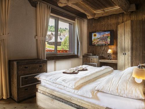 Grand Hotel**** Bachledka Strachanにあるベッド