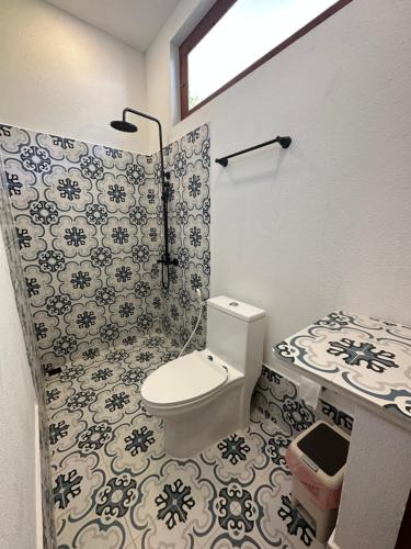 a bathroom with a toilet and a shower at Aqua oasis in Thoddoo