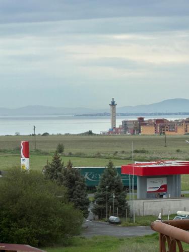 a view of a building with a lighthouse in the distance at PANTELI APART HOUSE in Aheloy