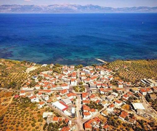 an aerial view of a town next to the ocean at Kikkos Village House in Néa Koróni
