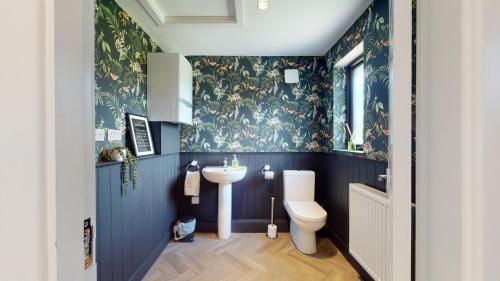 a bathroom with a sink and a toilet at Low Greenlands Holiday Park - Luxury House & Luxury Glamping Pods in Lancaster