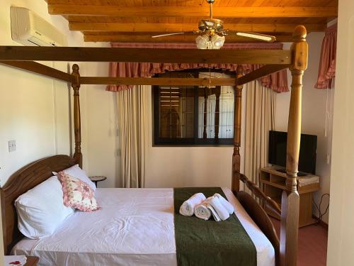a bedroom with a bed with two towels on it at VILLA AURA by AgroHolidays in Platres