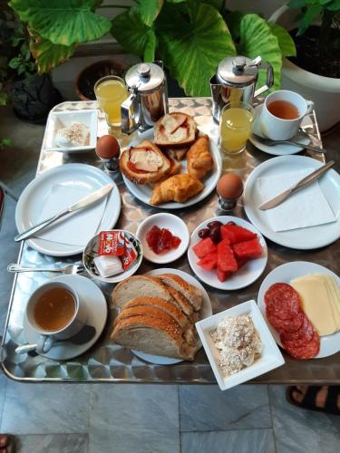 a tray of breakfast foods and drinks on a table at Ostria in Agia Galini