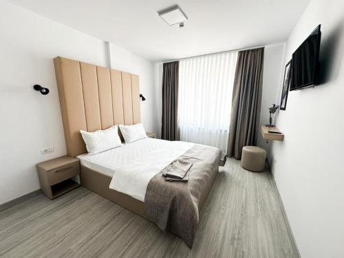 Ένα ή περισσότερα κρεβάτια σε δωμάτιο στο Partizan Resort