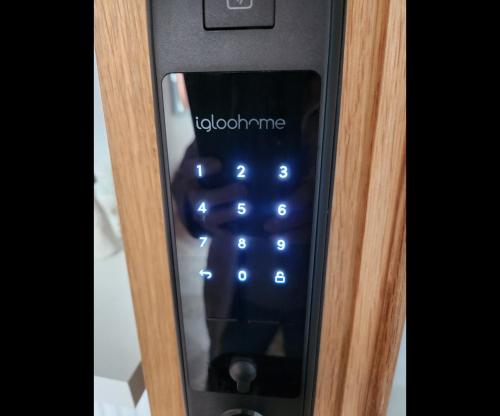 a close up of a television remote control at Captivating 2-Bed ground floor Apartment in Largs in Largs