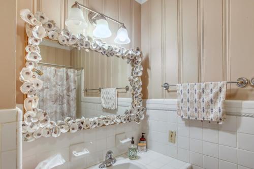 a bathroom with a sink and a mirror at Carolina Beach Home with Private Deck Walk to Shore in Carolina Beach