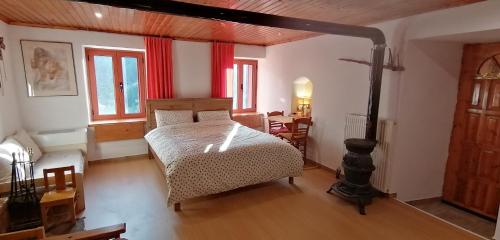 a bedroom with a bed and a wooden floor at Adonis Guest House in Dimitsana