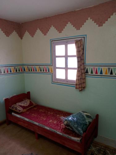 Hostel Yahdih Dakhla tesisinde bir odada yatak veya yataklar