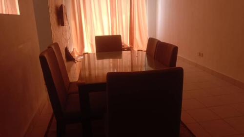 a dining room table and chairs in a room at PR1MA Presint 11 Putrajaya in Putrajaya