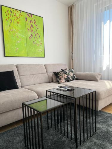 a living room with a couch and a coffee table at Apartman EMA in Banja Luka