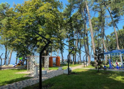a park with a playground and a swing set at Guest House Kobuleti on Aghmashenebeli in K'obulet'i