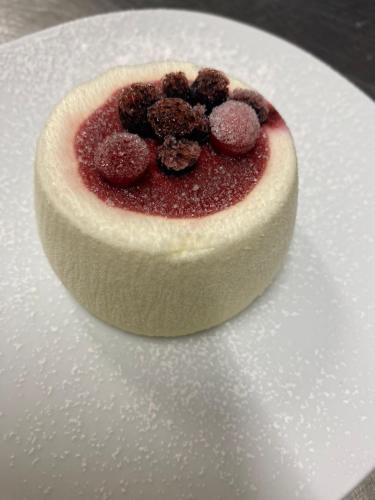 a dessert sitting on top of a white plate at Albergo Alla Posta in Anduins