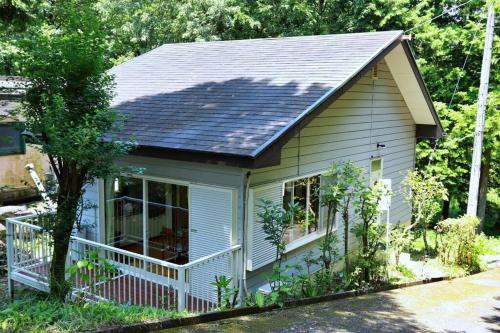 a small house with solar panels on the roof at FOREST HOUSE NIKKO in Nikko