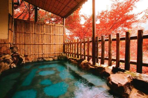 a small pool of water in a fence at FOREST HOUSE NIKKO in Nikko