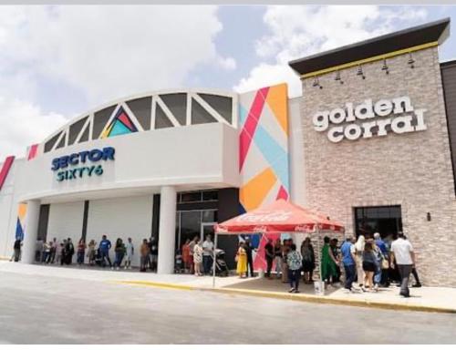 a group of people standing outside of a building at Villa Altiery Puerto Rico in Caguas