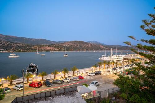 a view of a harbor with cars parked in a parking lot at Pink Panther Maisonette Suite in Argostoli