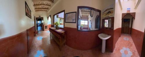 a bathroom with a toilet in a building at Kasbah La Famille Berbère in Boumalne