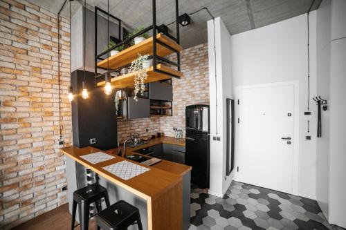 Dapur atau dapur kecil di Zielona Polana Luxury Apartment