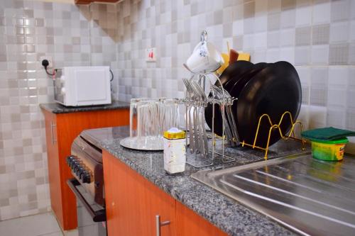 a kitchen with a sink and a counter top at Elegant Furnished 2 bedroom Apartment in Nairobi Ngara in Nairobi