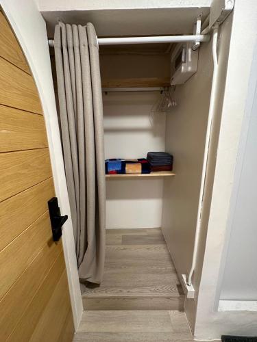 a stairway with a shower curtain in a room at Letter Better Home in Bangkok