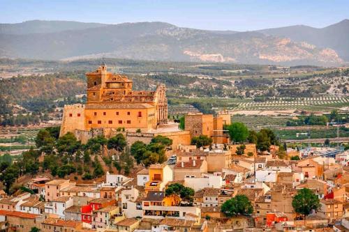 a view of a town with a castle on a hill at Sea View Family Villa with Private Pool, San Juan de los Terreros in Pulpí