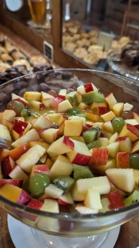 a glass bowl filled with fruits and vegetables on a table at Mas Ramades in L'Estartit