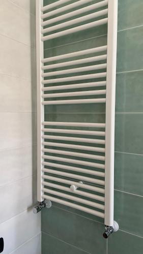 a shower with a glass door in a bathroom at I due ulivi in Arzano