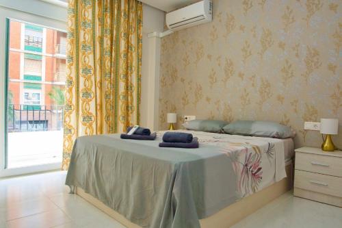 Postel nebo postele na pokoji v ubytování La Fuente apartamento con 3 AC