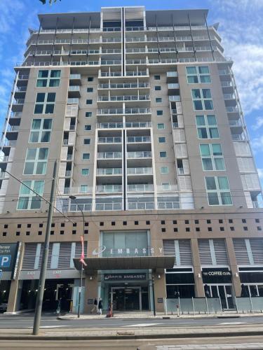 a large building on a city street with at Embassy apartment free parking in Adelaide