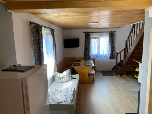 a small living room with a couch and a table at SKH R - 1 Bedroom in Praid