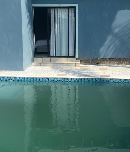 a pool of water in front of a house at Phindulo Bed and Breakfast - No Loadshedding, Smart TVs & unlimited free fibre wifi in Krugersdorp