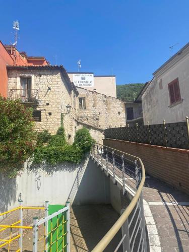 a tunnel in the side of a building at Affittacamere U’FURNILLO in Cautano