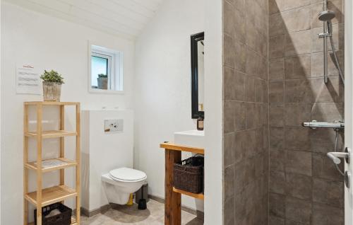 a bathroom with a toilet and a shower at 3 Bedroom Amazing Home In Silkeborg in Silkeborg