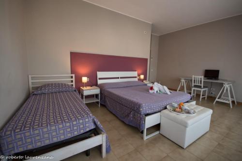 Postel nebo postele na pokoji v ubytování Hotel Palatinum