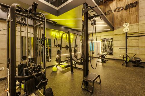 a gym with a lot of equipment in a room at Mava Apartamente in Constanţa