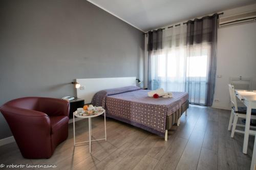 Postel nebo postele na pokoji v ubytování Hotel Palatinum
