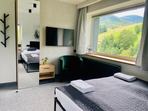 Postel nebo postele na pokoji v ubytování Villa Makuchówka