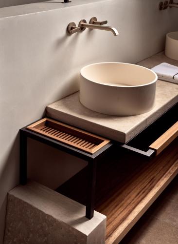 a bathroom with a sink on a counter at Acro Suites - A Wellbeing Resort in Agia Pelagia