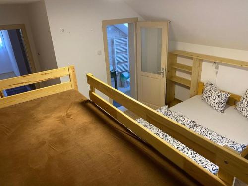a bedroom with two bunk beds and a hallway at Skh 3 in Praid