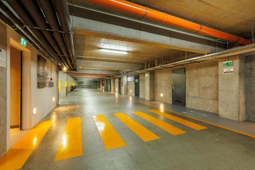 an empty hallway with yellow lines on the floor at Mava Apartamente in Constanţa