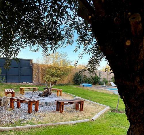 a group of picnic tables in a park at Olivos de Terrada in Ciudad Lujan de Cuyo