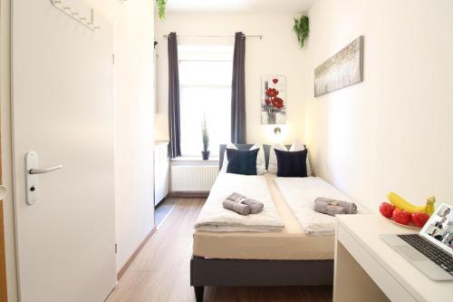Un pat sau paturi într-o cameră la Downtown Apartments Ulm - im Herzen von Ulm & komfortable Boxspringbetten
